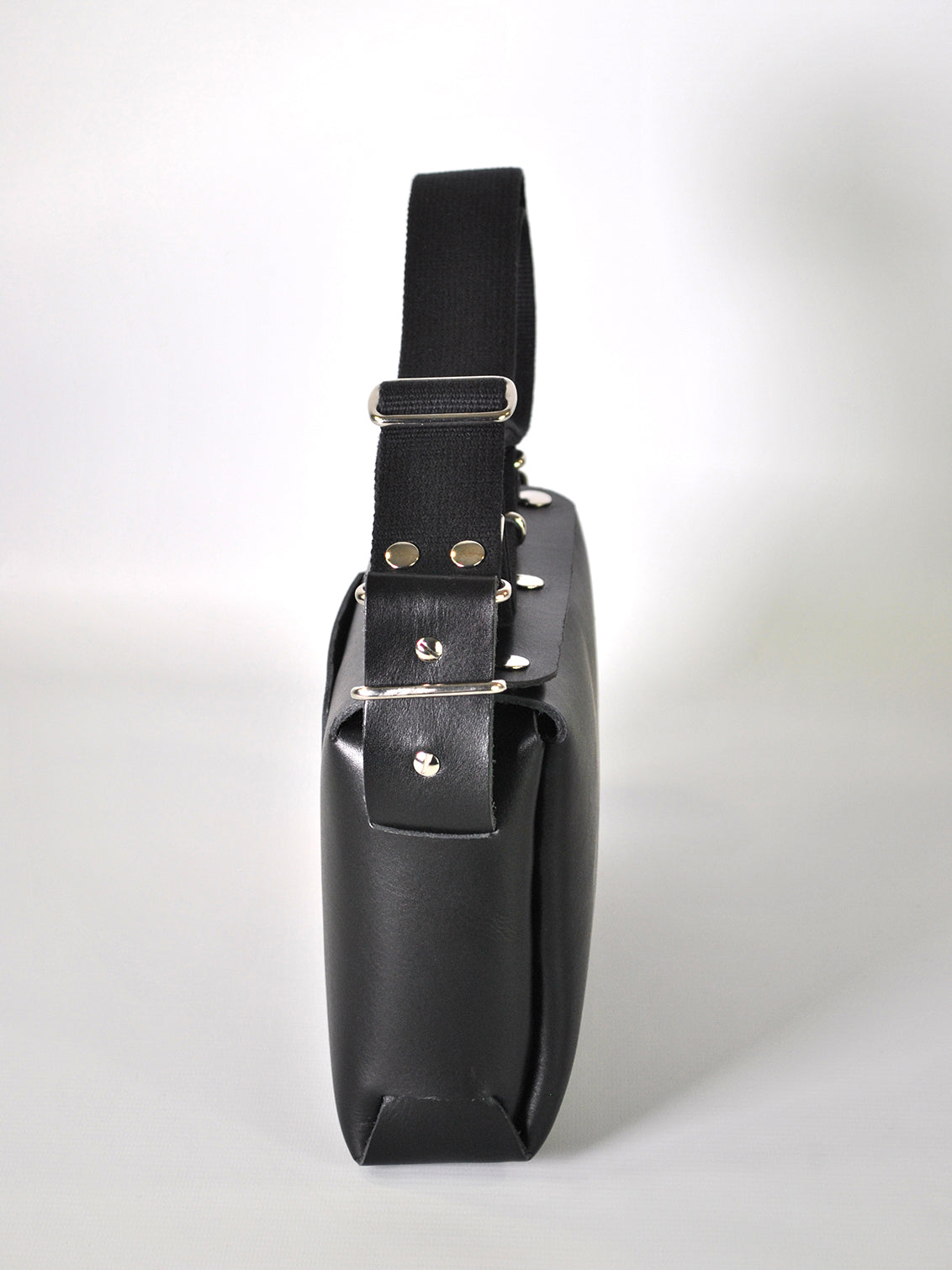 Black leather crossbody bag with silver hardware for everyday use